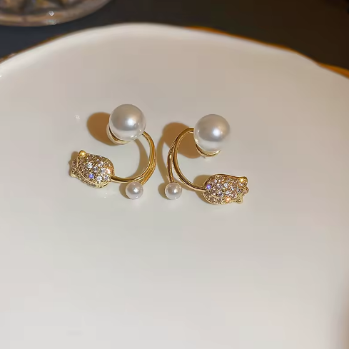 Tulip and Pearl Ear Jacket Studs - ORYX TREND EaringUnique ear jackets featuring a pave crystal tulip/flower stud with a curved gold bar that sits behind the lobe, tipped with graduated faux pearls.Default Title#