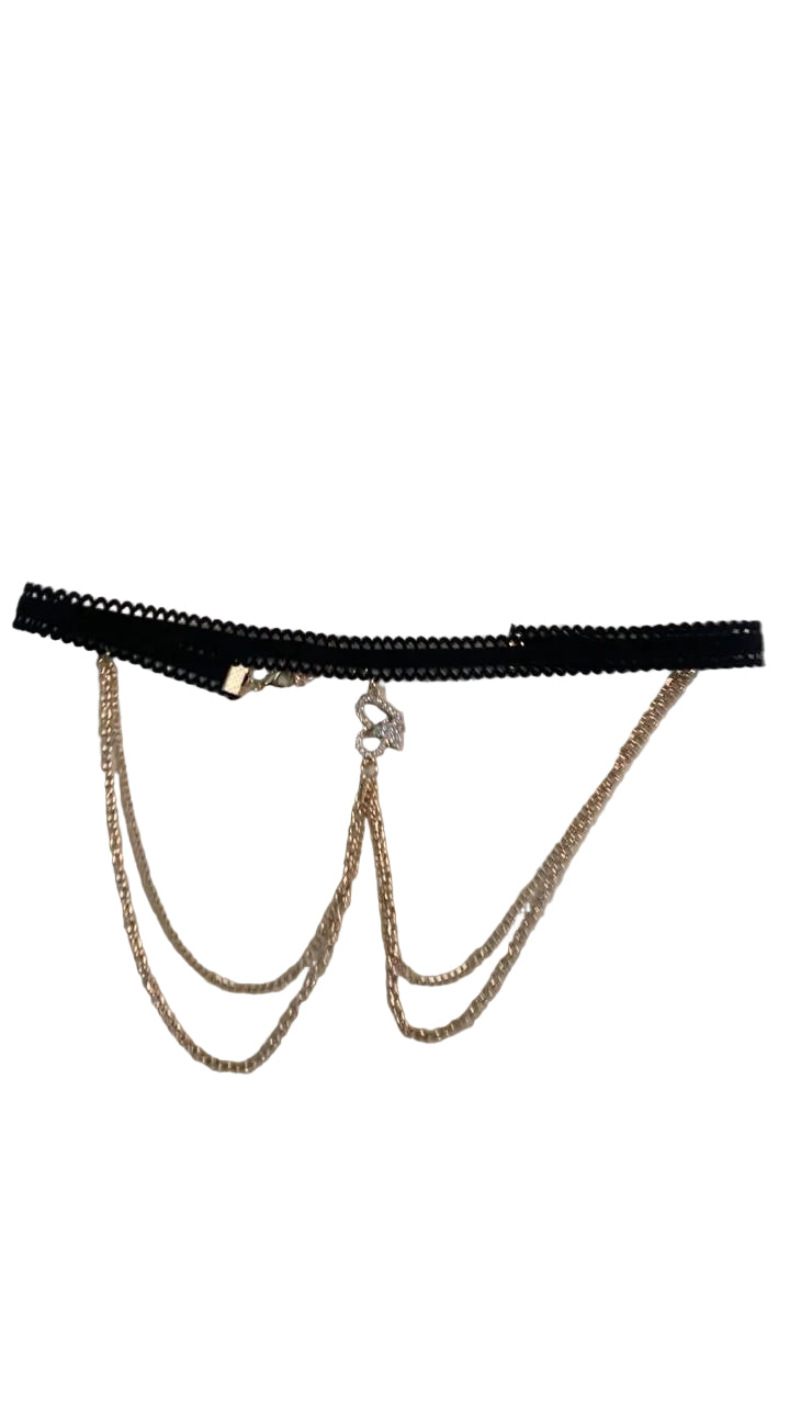 Black thong with gold chain detail on a white background